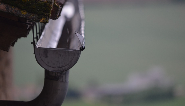 A clean gutter on the side of a house