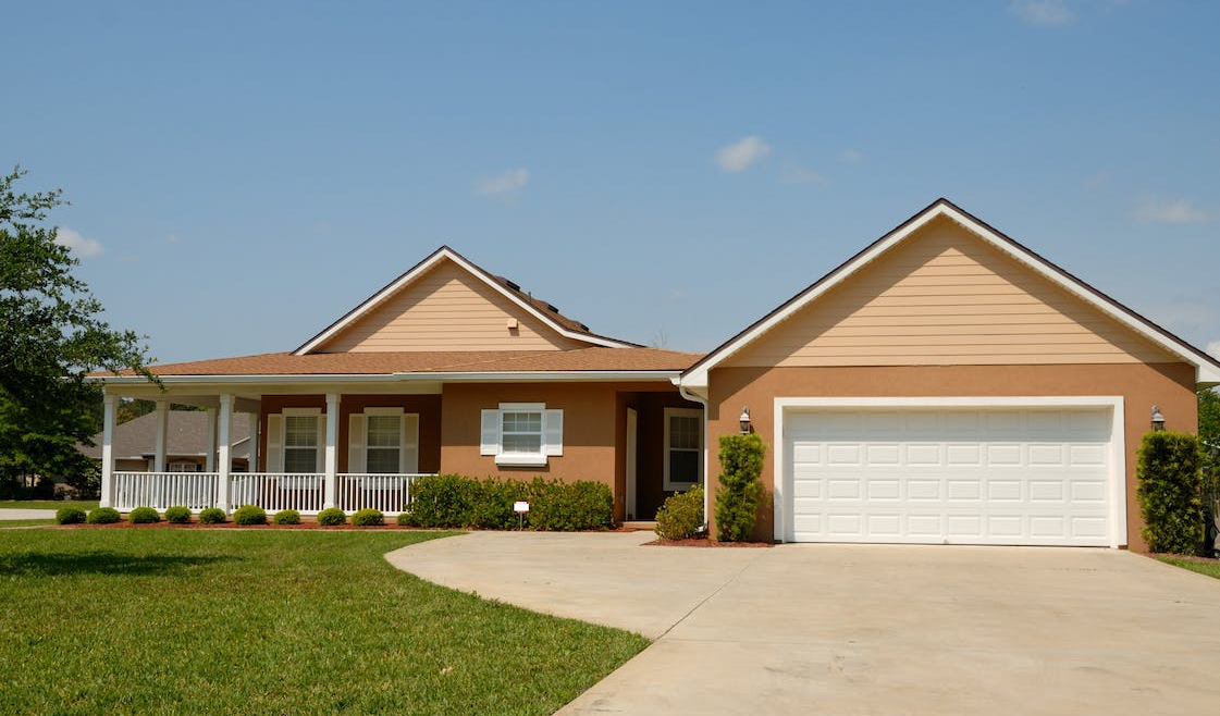 A home with a white garage door and driveway